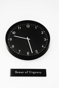sense of urgency image showing a clock with the words below it